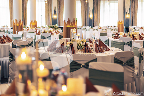 Image of Decorated tables and modern lighting