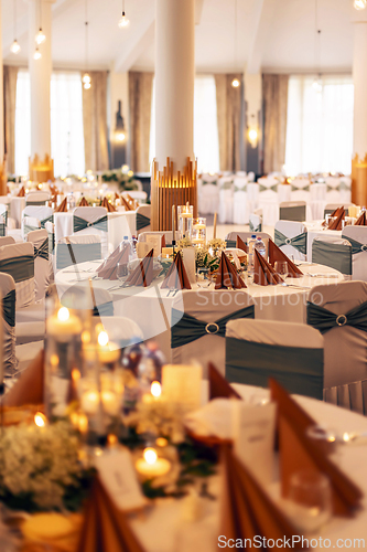 Image of Intimate and warm candlelit table setting