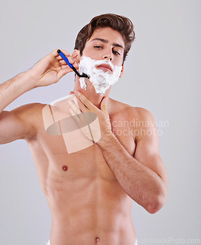 Image of Razor, shave and man on gray background with foam for wellness, hair removal and beauty in studio. Skincare, dermatology and isolated person with shaving cream for cosmetics, grooming and hygiene