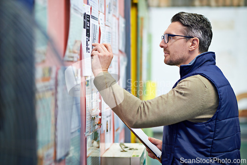 Image of Man, business and board for planning schedule or calendar for shipping details, supplier information and warehouse. Male person, clipboard and notes for orders or inventory, poster and distribution