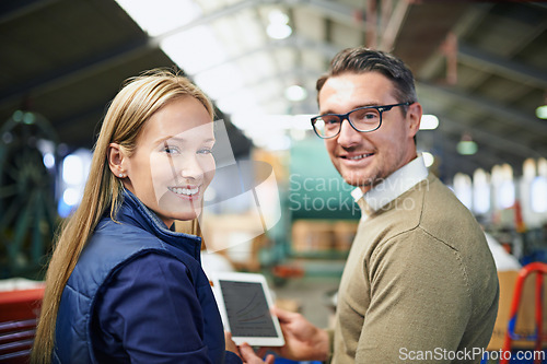 Image of Business people, industry and portrait in warehouse with tablet for collaboration, ecommerce and distribution. Woman, man and smile with digital technology for supply chain, teamwork and inspection