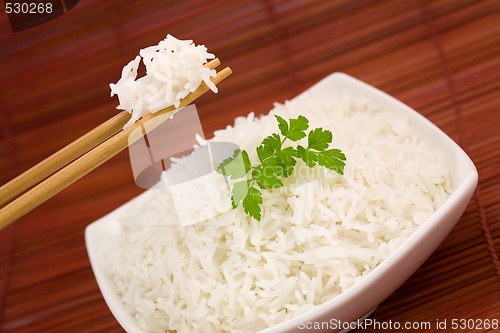 Image of Bowl of rice on mat