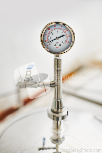 Image of Beer, production and temperature with steel in factory for winery, alcohol and drink manufacturing or distillery. Thermometer, container and fermentation vessel in closeup for brewery and industry