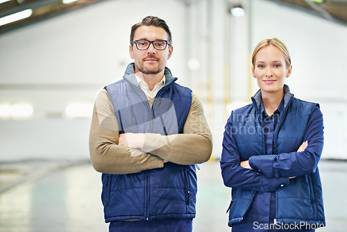 Image of Manager, smile and portrait in warehouse for production process, industry and manufacturing for distribution. Young people or workers for maintenance and quality control for supply chain and stock