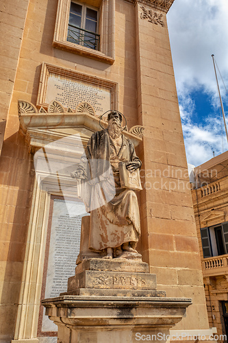 Image of Statue in front of majestic Dome, The Rotunda of Mosta, Malta