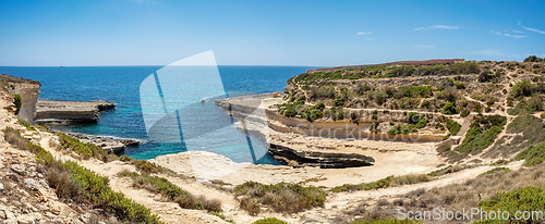 Image of Crystal clear turquoise water in blue lagoon. St. Peters pool - rocky beach at Malta