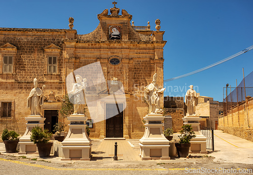 Image of Saint Augustine convent with statues at the entrance in Victoria. Gozo Malta