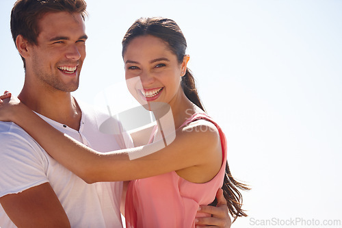 Image of Happy couple, portrait and hug in nature with sky background, love and care with time together for travel. Safety, security and trust, comfort or support, people in relationship and romance outdoor