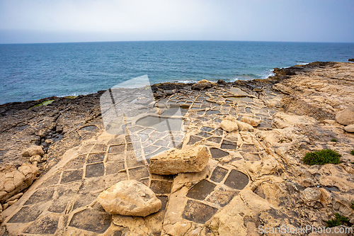 Image of Traditional salt pans in Zabbar Bay on the beach of island Malta.