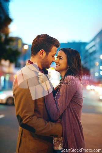 Image of Couple, night and city with hug for love, bonding and romance in relationship with life partner. Happiness, affection and people with commitment and trust, sweet moment and romantic together outdoor