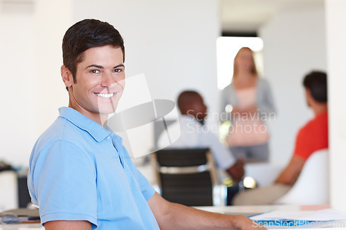 Image of Casual, male person and smile in portrait at office with colleagues, working or job or happy. Businessman, company and confidence with coworkers at desk for events management, planner or coordinator