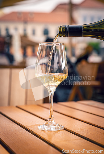 Image of Pouring white wine into a glass 