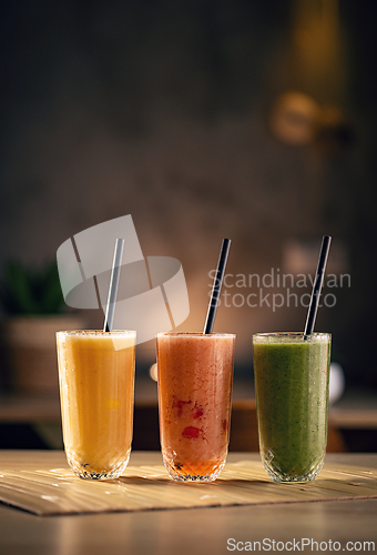 Image of Three colorful fruit smoothies