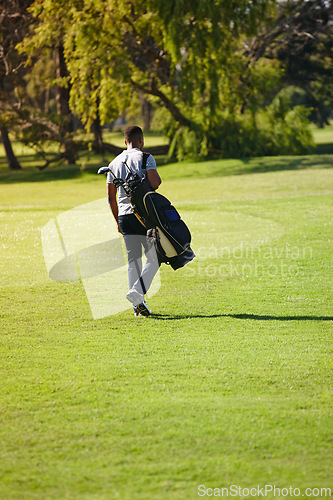 Image of Sports, bag and walking on golf course with man or athlete outdoor on luxury holiday or vacation. Grass, field and exercise in summer on lawn with person in countryside for training or workout