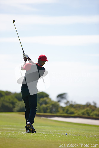 Image of Man, back and swing with golf course for stroke, point or strike on grass field in nature. Rear view of male person, golfer or sports player missing ball for game or outdoor match on mockup space