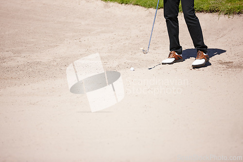 Image of Golf, club and bunker with ball for shot with closeup of legs on pitch for recreational hobby. Sport, driving range and sand with man on course for accuracy with practise for skill development