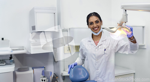 Image of Dentist, portrait and woman by xray machine with smile for mouth care, dental health and service. Medical professional, happy and equipment in office for oral hygiene, dentistry and examination