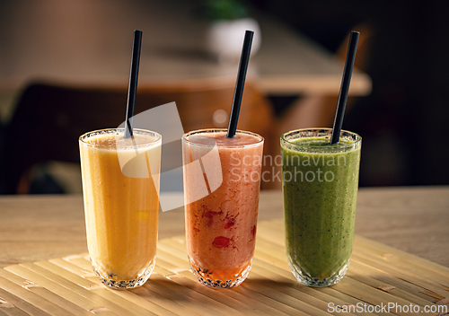 Image of Three colorful fruit smoothies