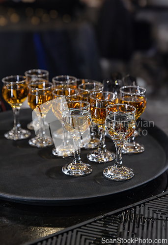 Image of Elegant glasses of amber liquor