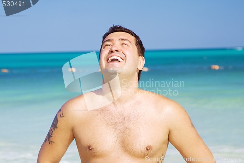 Image of happy man on the beach