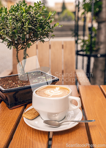 Image of Cup of cappuccino with latte art 