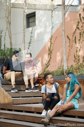 Image of College, campus and students relax on stairs with social community, friends and chat about course. People, talk and conversation about steps in university project or support for education or study