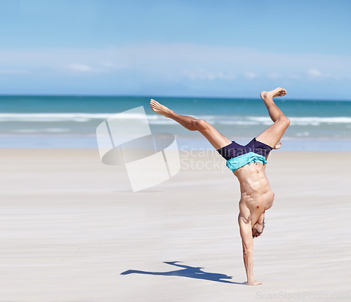 Image of Man, calisthenics and body at sea for exercise with summer, health and wellness. Male athlete, ocean water and activity for sports training with sunshine, strong muscles and hand at Cape Town beach