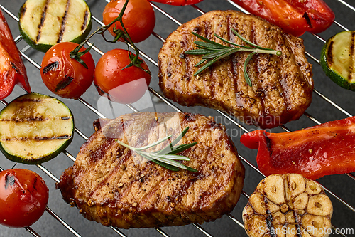 Image of grilled steaks and vegetables