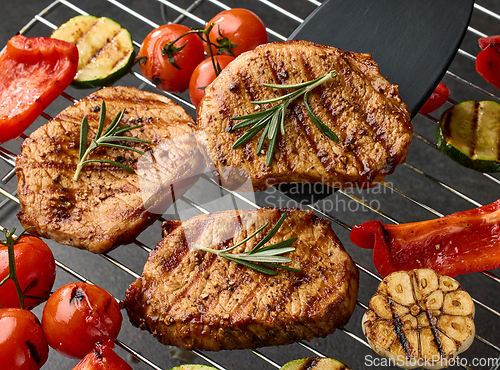 Image of grilled steaks and vegetables