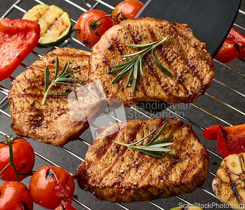Image of grilled steaks and vegetables