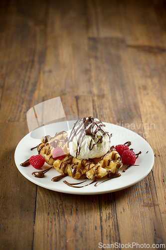 Image of plate of belgian waffle with ice cream