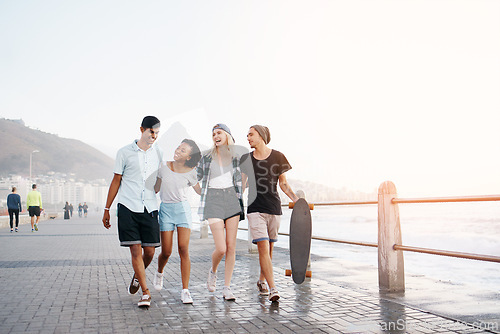 Image of Happy, walking and couple of friends by ocean laugh for holiday, summer vacation and relax. Double date, promenade and men and women smile by seaside for travel, weekend and fun together for bonding