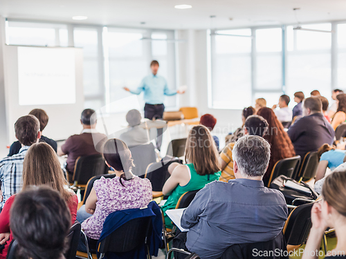 Image of Speaker giving presentation on business conference.