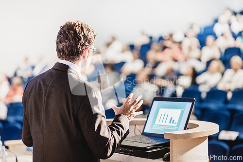 Image of Speaker at Business Conference and Presentation.