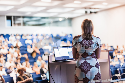 Image of Public speaker giving talk at Business Event.