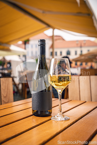 Image of Bottle of white wine and glass