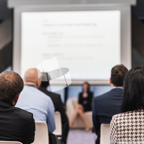 Image of Woman giving presentation on business conference event.