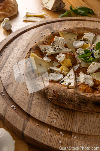Image of Delicious artisanal four cheese pizza