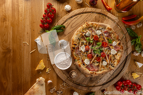 Image of Top view of rustic homemade pizza