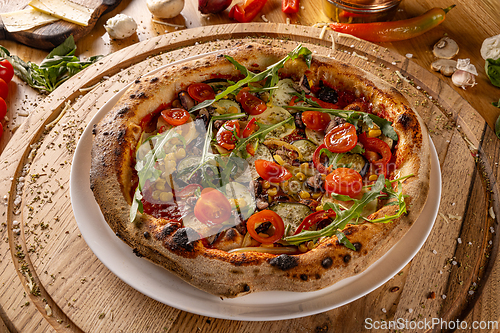 Image of Vegetarian pizza with tomatoes
