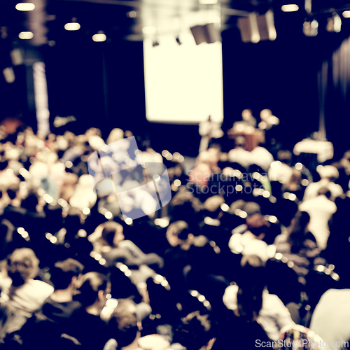 Image of Speaker giving presentation on scientific business conference.