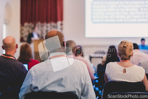 Image of Speaker at Business Conference and Presentation.