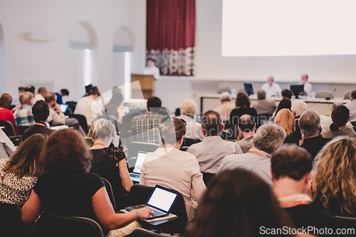 Image of Speaker at Business Conference and Presentation.