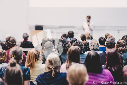 Image of Woman giving presentation on business conference event.