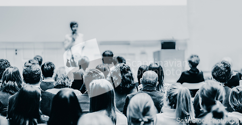 Image of Woman giving presentation on business conference event.