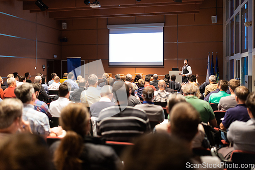 Image of Business speaker giving a talk at business conference meeting event.