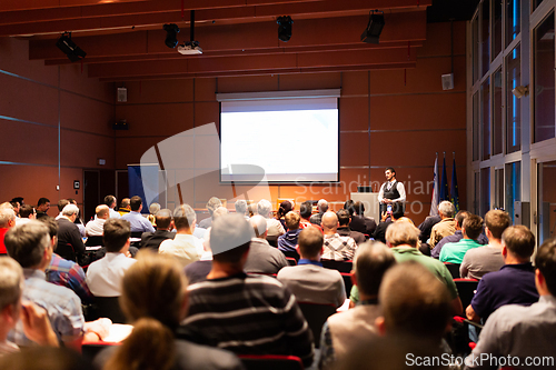 Image of Business speaker giving a talk at business conference meeting event.