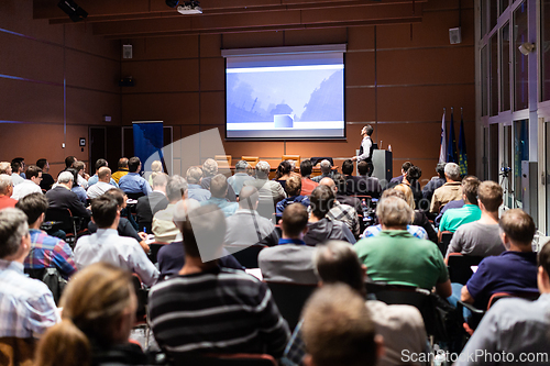 Image of Business speaker giving a talk at business conference meeting event.