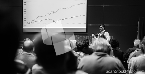Image of Speaker giving presentation on business conference event.
