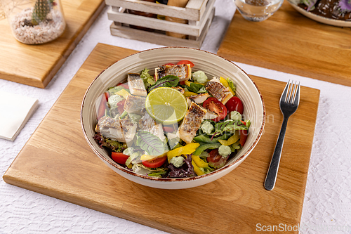 Image of Fresh and healthy salad with grilled fish